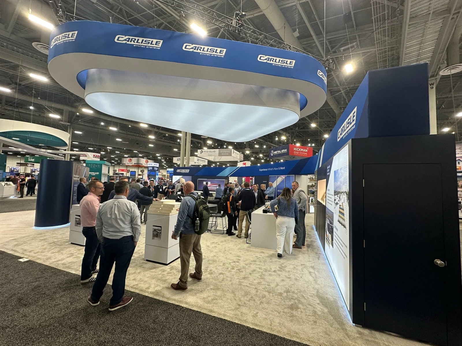 The booth on the show floor, under its ring