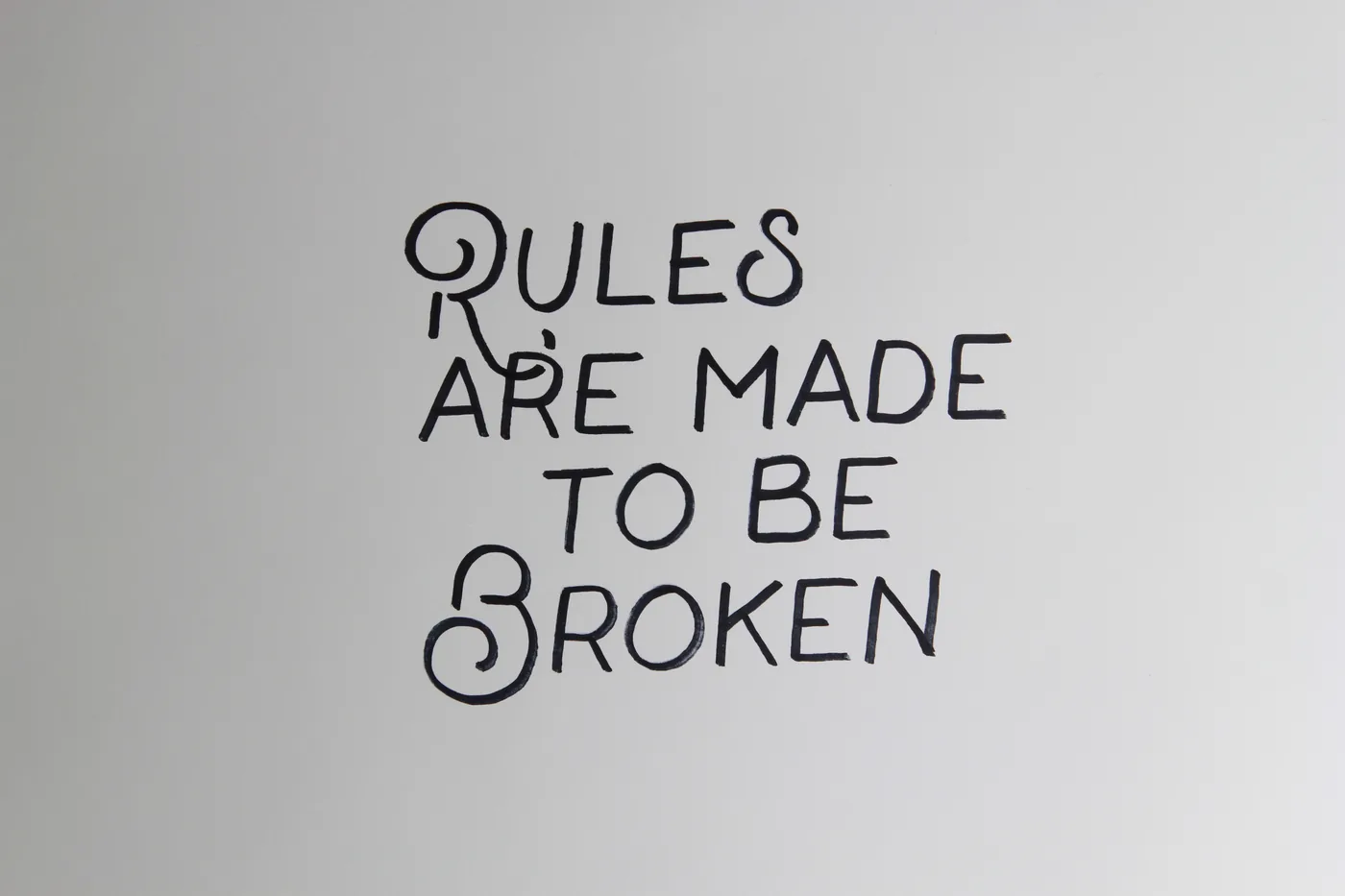 Rules are made to be broken. Lettering by hand.
