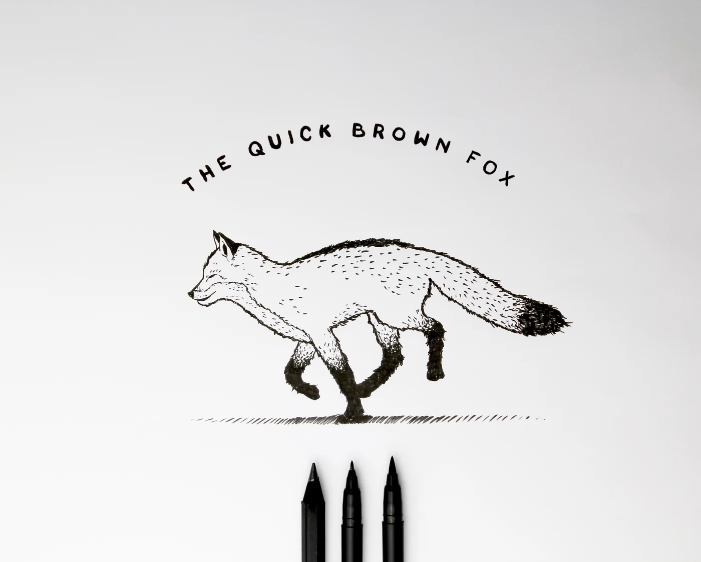 The quick brown fox. Lettering and illustration by hand.
