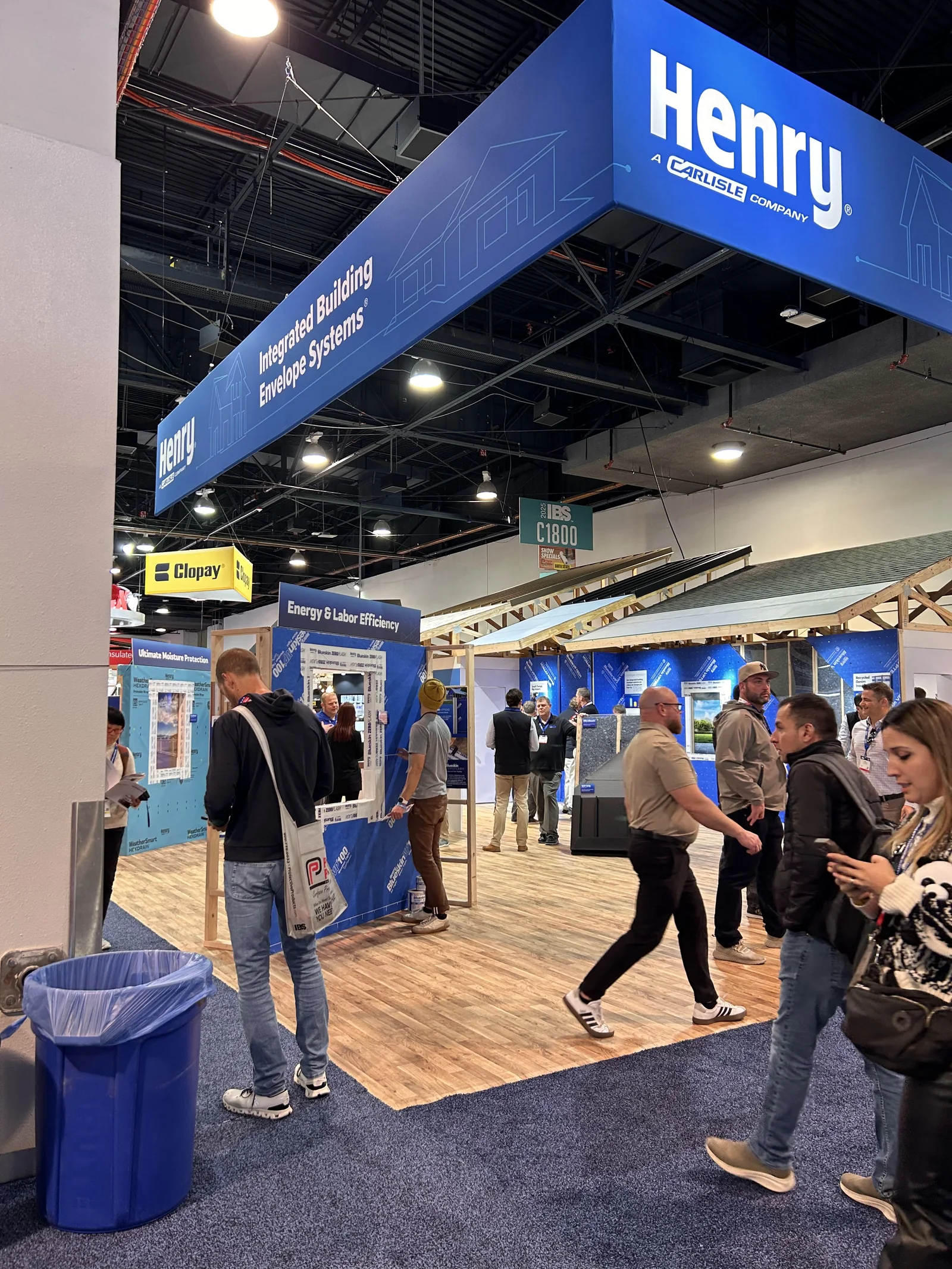 Down the aisle: the Henry sign over the booth&rsquo;s framed walls