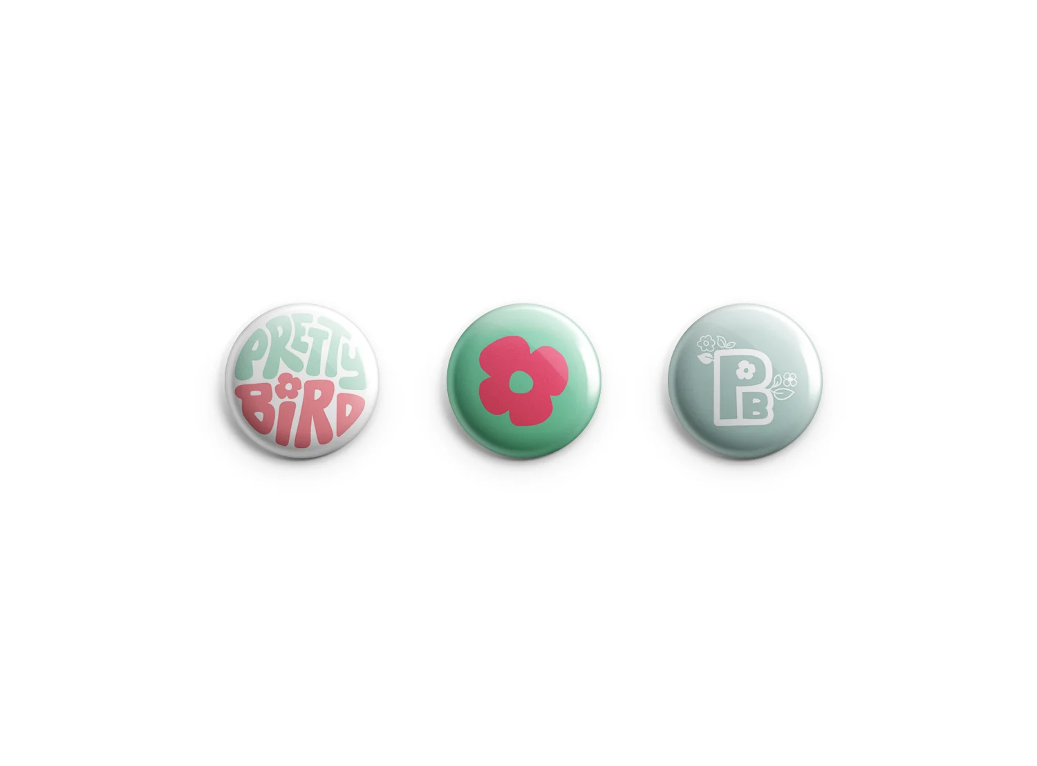 Three buttons: the mark, the flower and the PB monogram